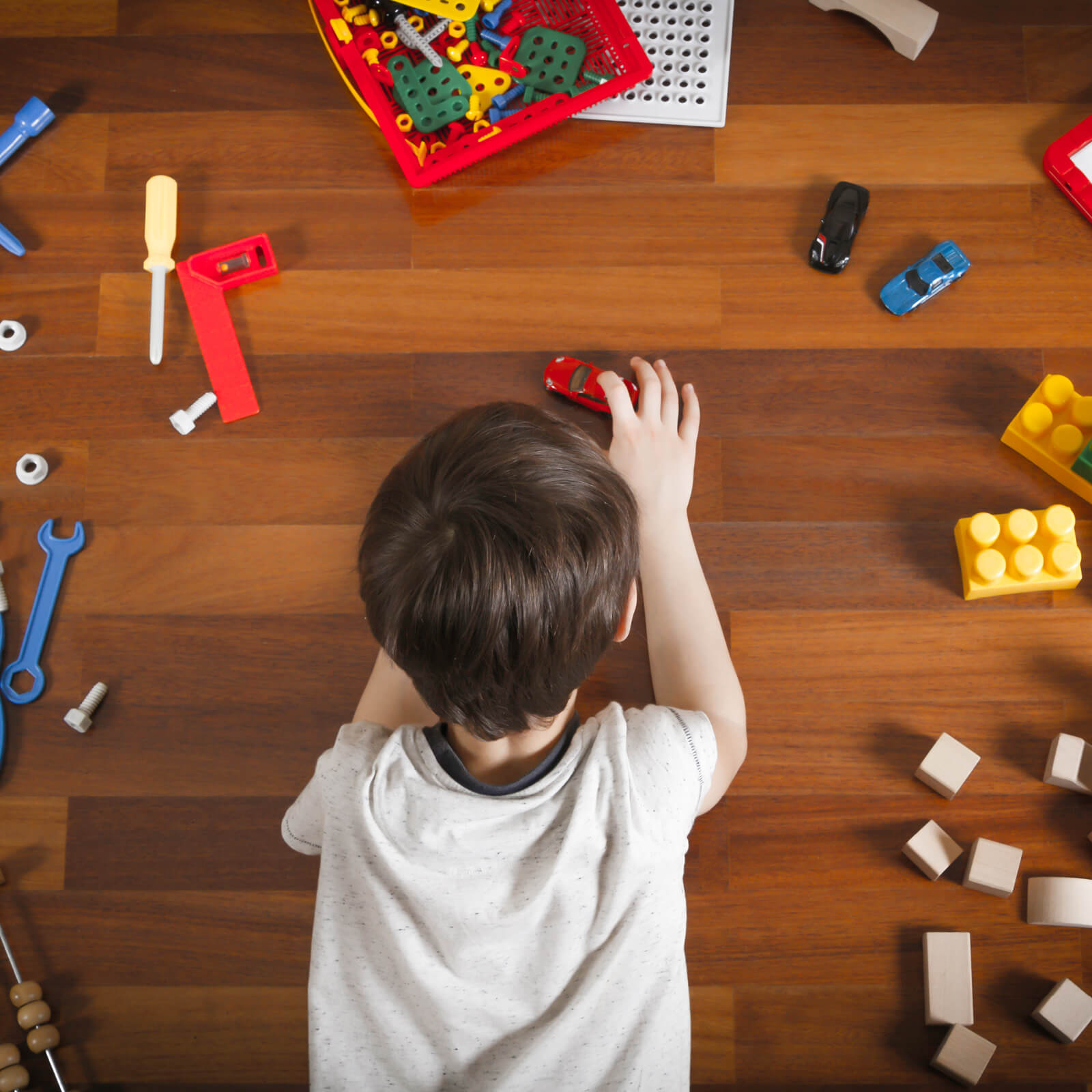 Kid playing with toy cars | Key Carpet Corporation