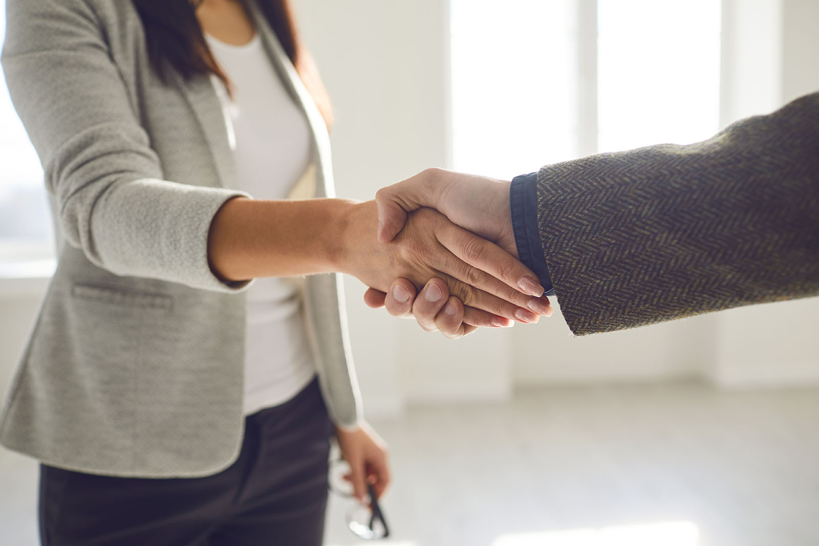 Handshake of businesspeople | Key Carpet Corporation